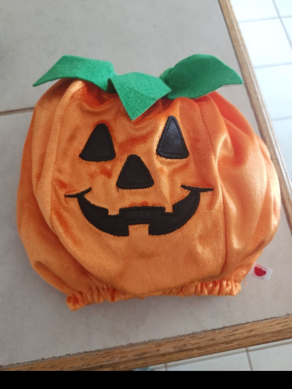 orange Build-A-Bear pumpkin costume features a plush material Embroidered Face